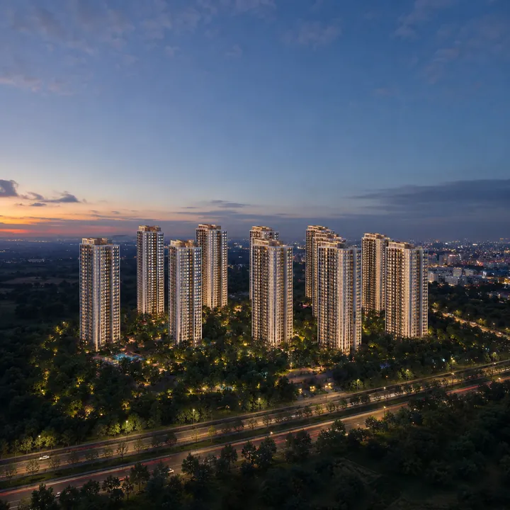 Sattva Mysore Road eleven-tower skyline illuminated at night above the Mysore Road corridor
